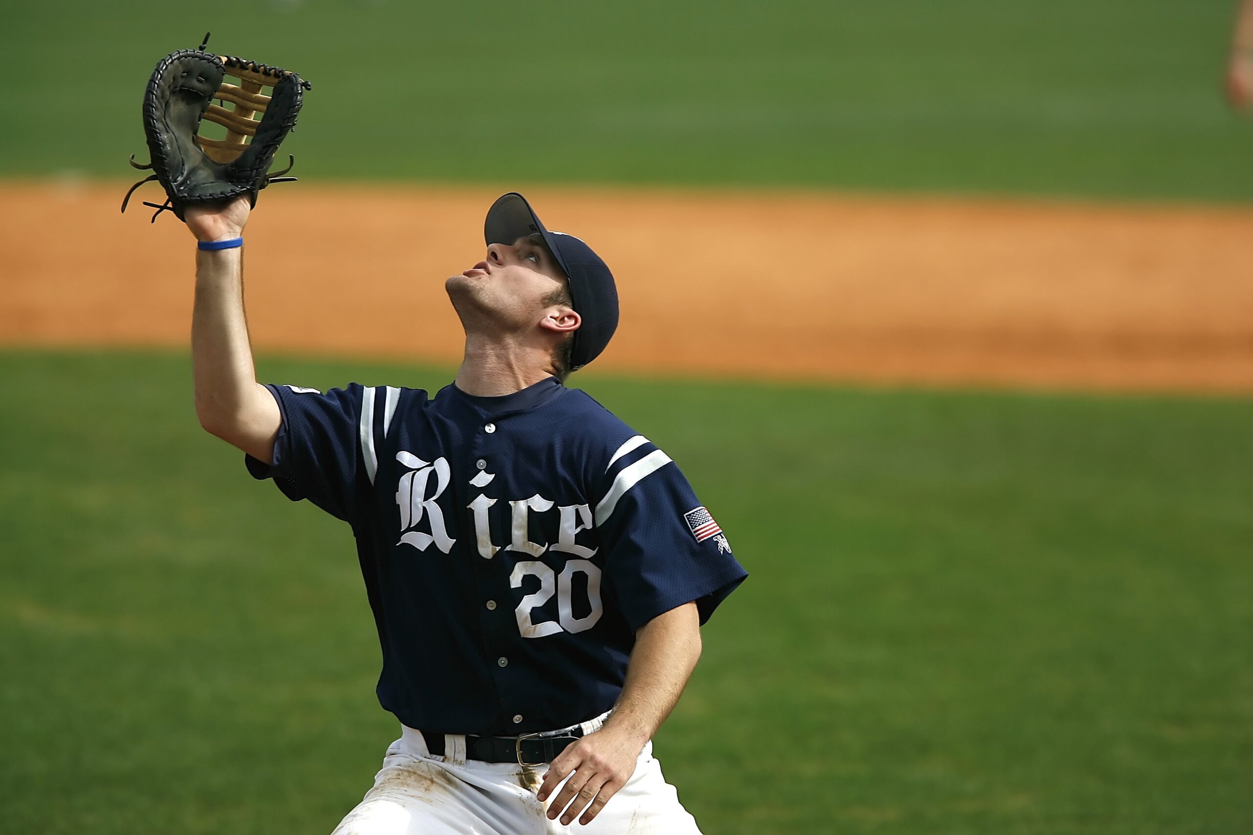 Baseball-player-in-blue-and-white-jersey-looking-up