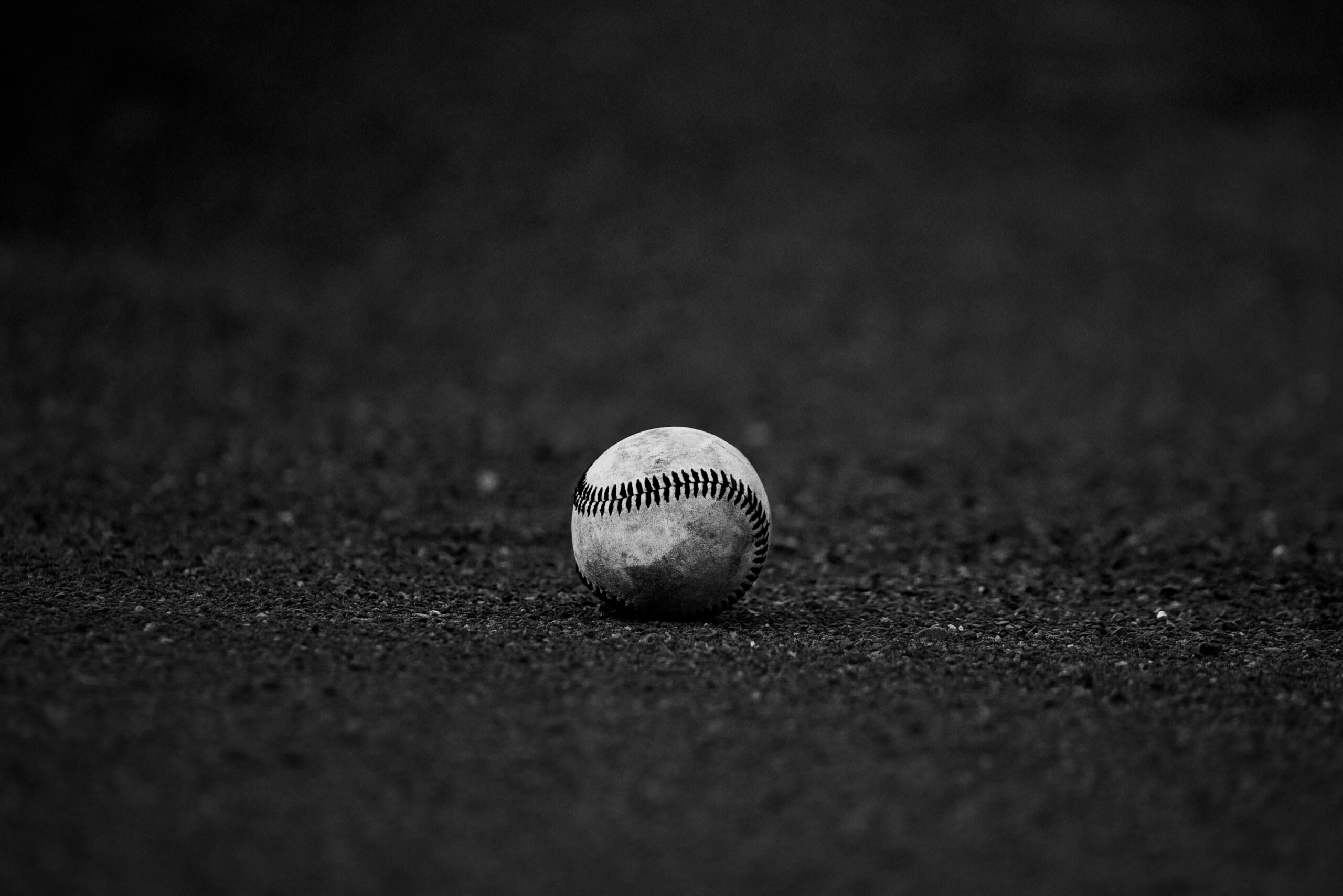 selective-focus-grayscale-photography-of-baseball