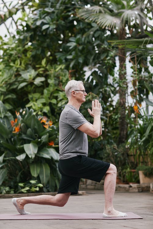 Elderly man practicing yoga