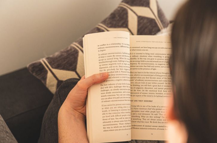 person-holding-white-book-page