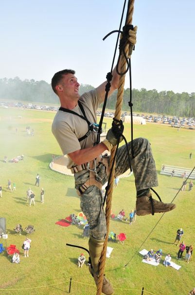 A military climbing the rope