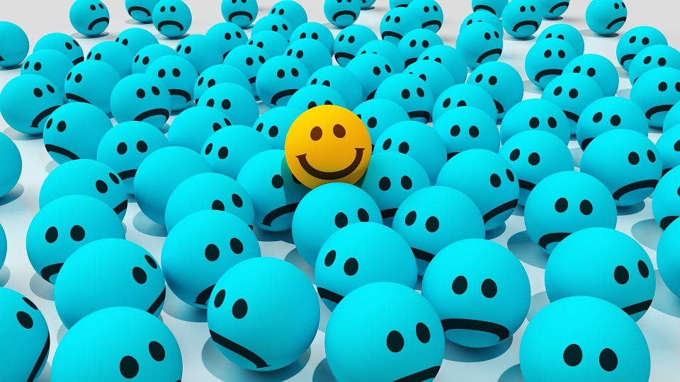 yellow smiling emoji, blue sad emojis
