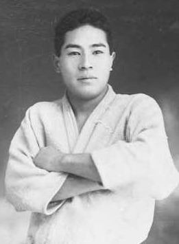 A black and white image showing Minoru Mochizuki. 