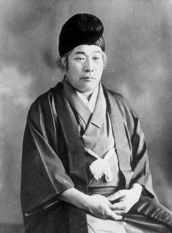 A black and white image showing a portrait of Onisaburo Deguchi