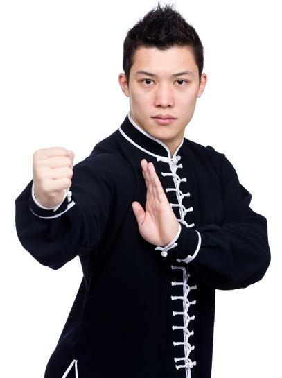 An Asian man wearing a Kung Fu uniform
