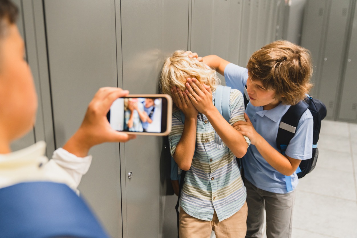 A boy bullied filming it