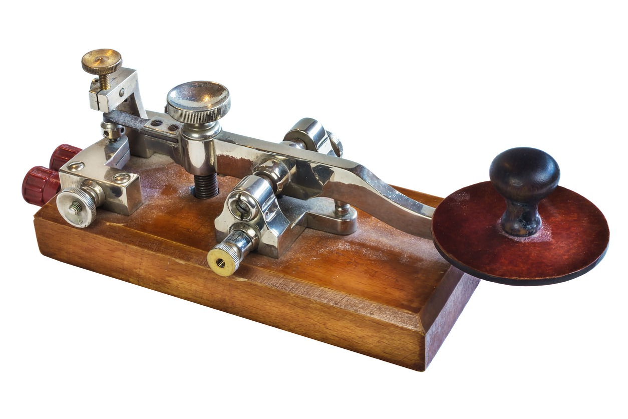 A telegraph machine made of wood and metal