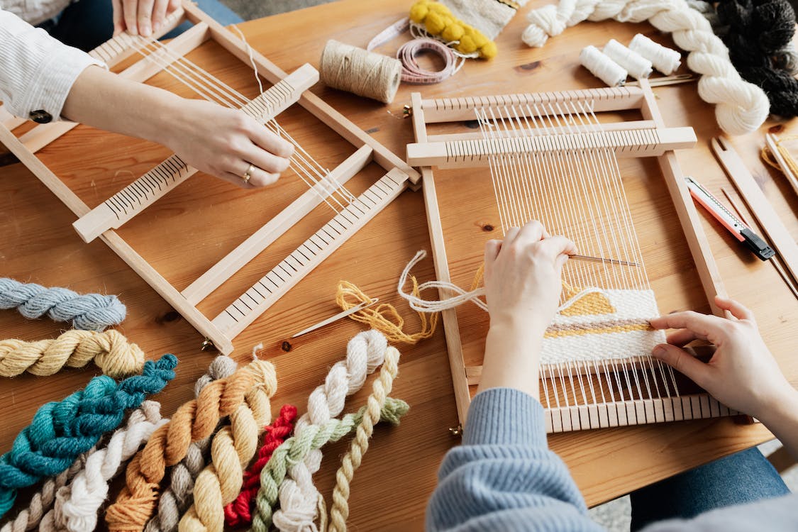 Two Person's Hands Weaving
